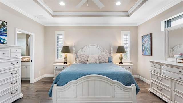 135 Cabana Way, Rotonda West, FL 33947 - bedroom featuring a tray ceiling, dark wood-style floors, multiple windows, crown molding, and recessed lighting