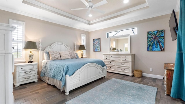 135 Cabana Way, Rotonda West, FL 33947 - bedroom featuring a raised ceiling, multiple windows, baseboards, dark wood-style floors, and crown molding