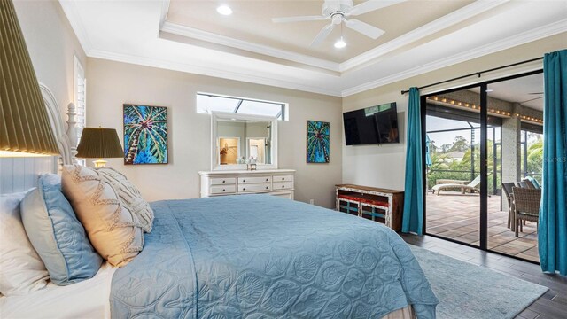 135 Cabana Way, Rotonda West, FL 33947 - bedroom featuring access to exterior, wood finished floors, ornamental molding, a raised ceiling, and a ceiling fan