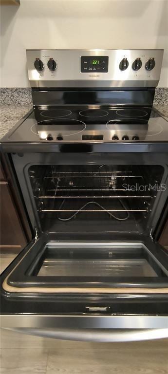 room details featuring stainless steel electric stove