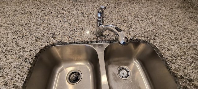 details featuring dark stone counters and a sink