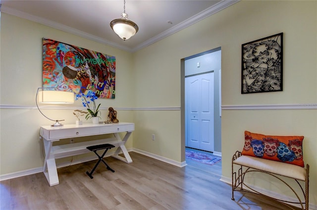 office featuring baseboards, crown molding, and wood finished floors