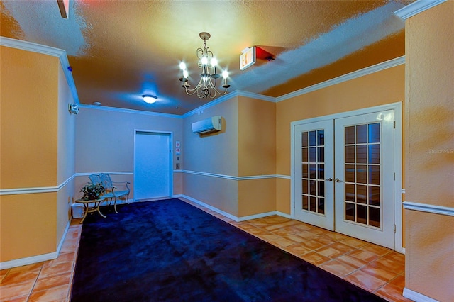 interior space featuring ornamental molding, french doors, a wall unit AC, and an inviting chandelier