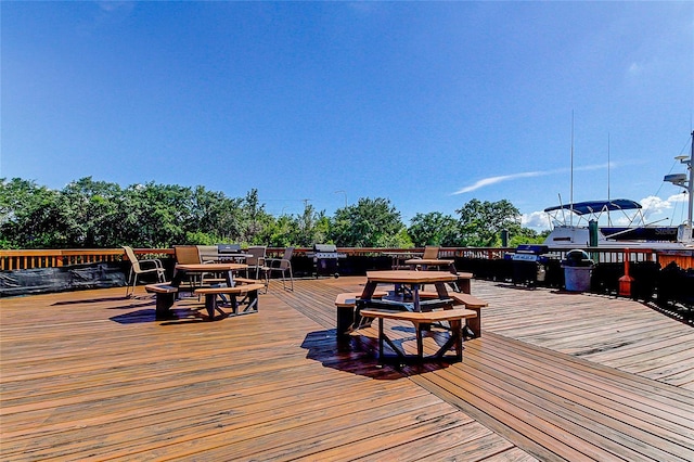 wooden deck with outdoor dining area