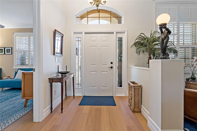 entrance foyer featuring light wood-style floors and baseboards