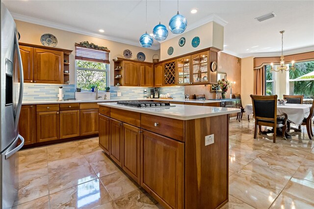 kitchen with stainless steel appliances, brown cabinetry, ornamental molding, and open shelves