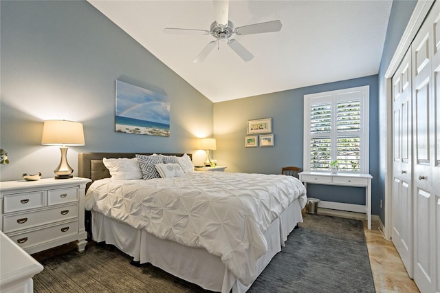 bedroom with lofted ceiling, a closet, and a ceiling fan