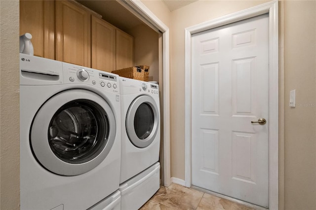 laundry area with cabinet space and independent washer and dryer