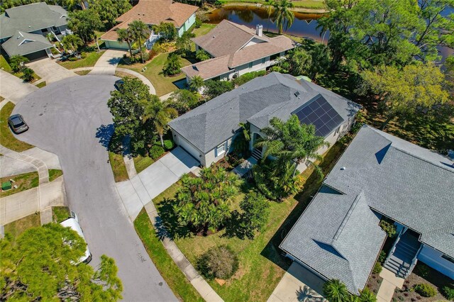 bird's eye view featuring a water view and a residential view