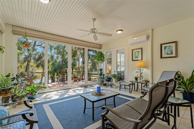 sunroom featuring ceiling fan and a wall mounted AC