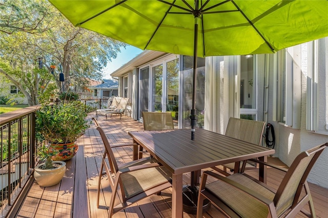 wooden deck with outdoor dining space