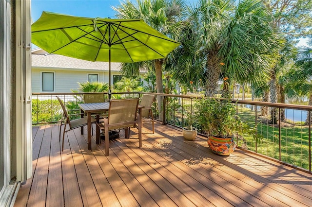 wooden deck featuring outdoor dining area