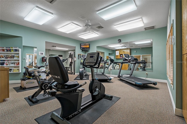 workout area with visible vents and a textured ceiling