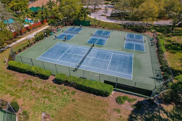 view of sport court with fence