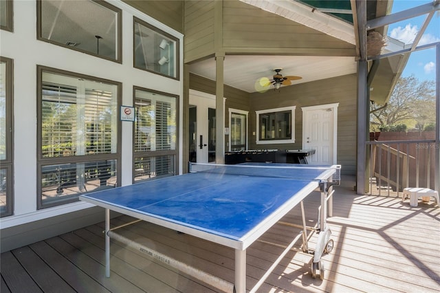 wooden terrace featuring a ceiling fan