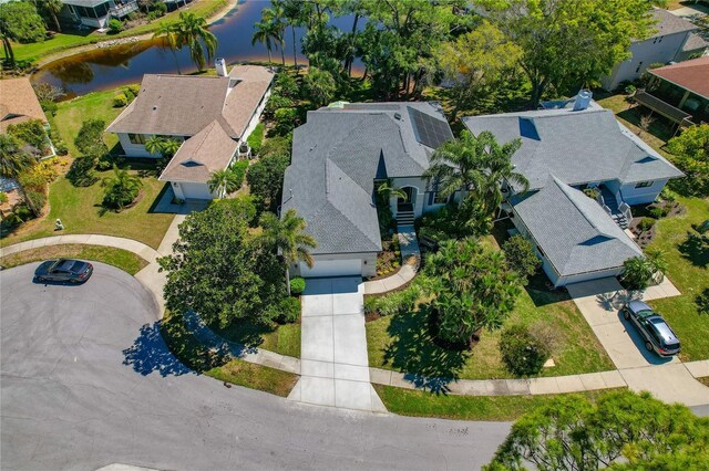 birds eye view of property with a residential view and a water view