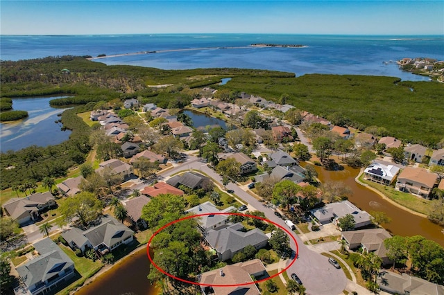 bird's eye view featuring a water view and a residential view