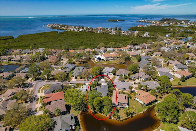 bird's eye view featuring a water view and a residential view