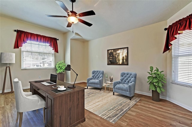 office with ceiling fan, wood finished floors, and baseboards