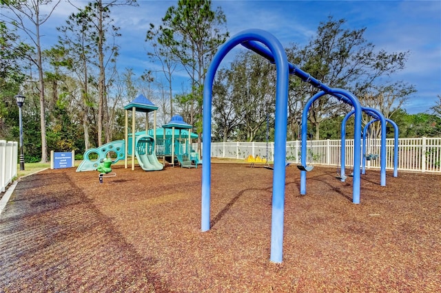 community jungle gym featuring fence