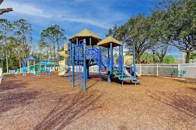 communal playground featuring fence