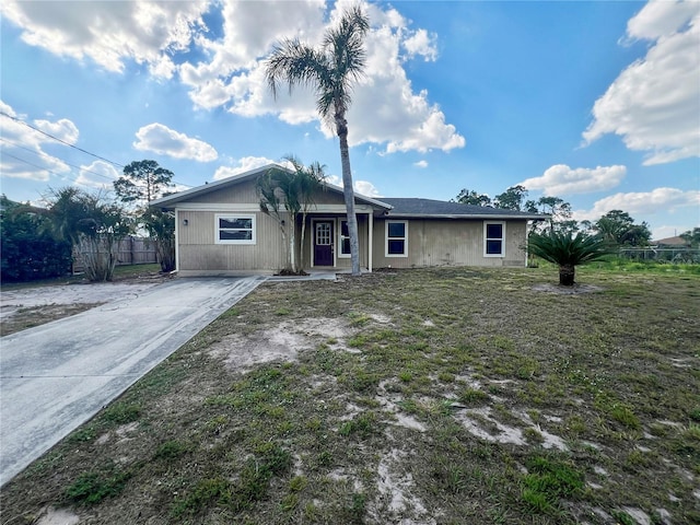 single story home featuring a front yard and fence