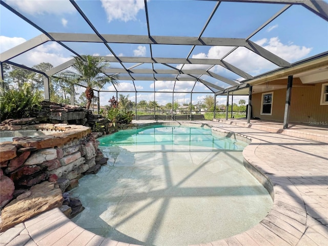 pool featuring a lanai and a patio