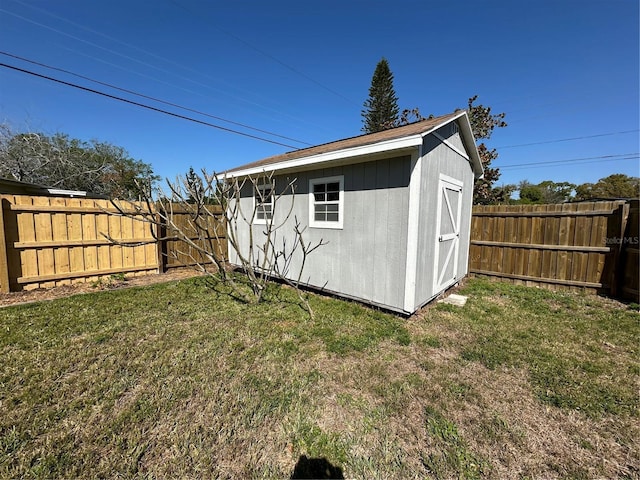 view of shed featuring a fenced backyard