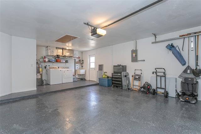 garage featuring washer and dryer, electric panel, a sink, electric water heater, and a garage door opener