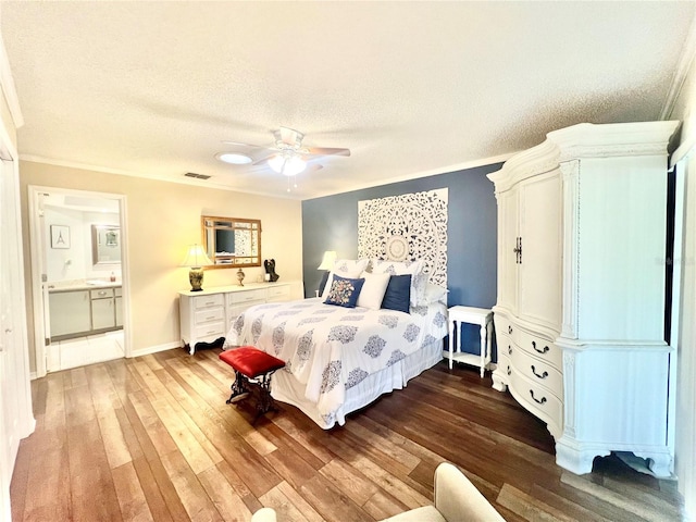 bedroom with visible vents, baseboards, a textured ceiling, a ceiling fan, and dark wood-style flooring