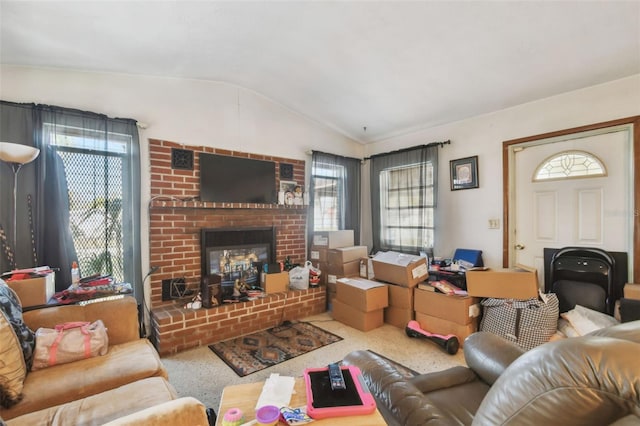 living room featuring a fireplace and vaulted ceiling