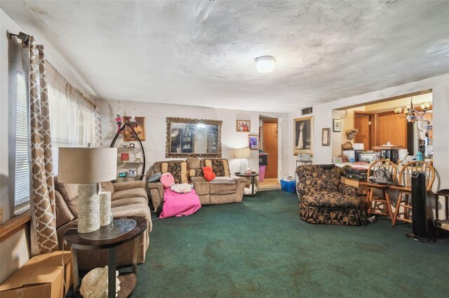 carpeted living area featuring a notable chandelier