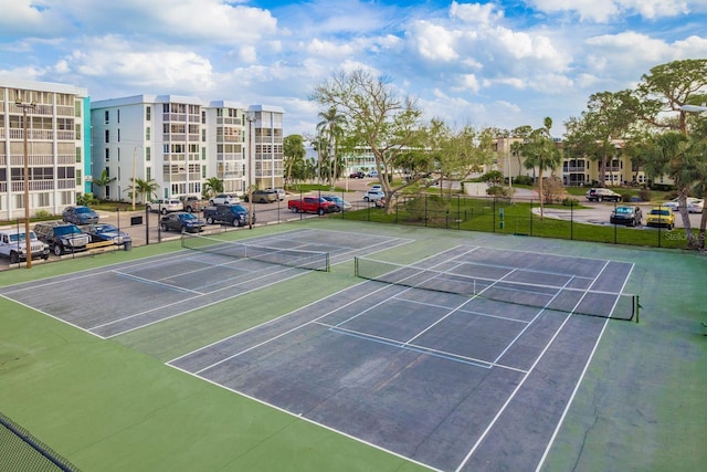 view of sport court with fence