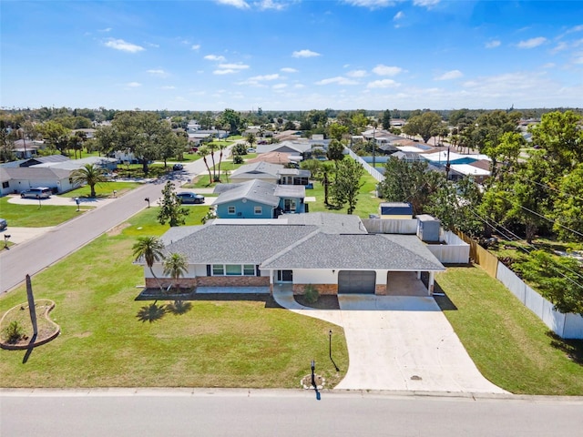 birds eye view of property with a residential view