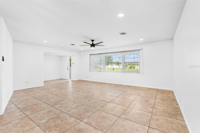 empty room with light tile patterned floors, recessed lighting, visible vents, baseboards, and a ceiling fan