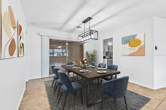 dining room featuring visible vents, baseboards, and light tile patterned floors