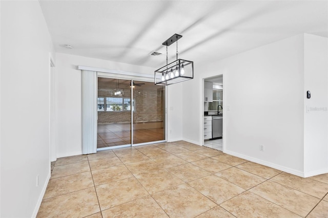 unfurnished dining area featuring light tile patterned floors, visible vents, and baseboards