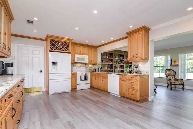 kitchen with crown molding, visible vents, light wood-style floors, light stone countertops, and white appliances