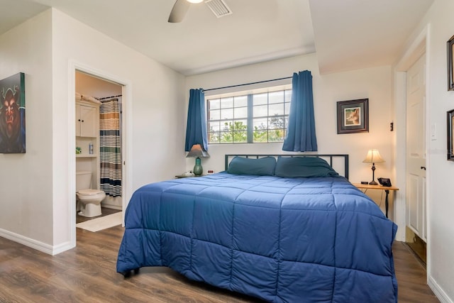 bedroom with baseboards, visible vents, dark wood finished floors, and a ceiling fan