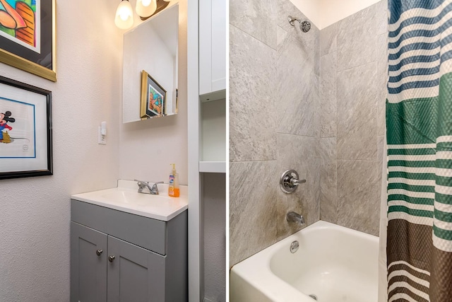 full bathroom featuring shower / bath combo with shower curtain and vanity