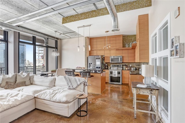 living area with concrete floors and a city view