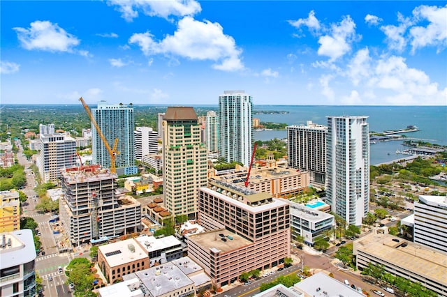 drone / aerial view featuring a water view and a view of city