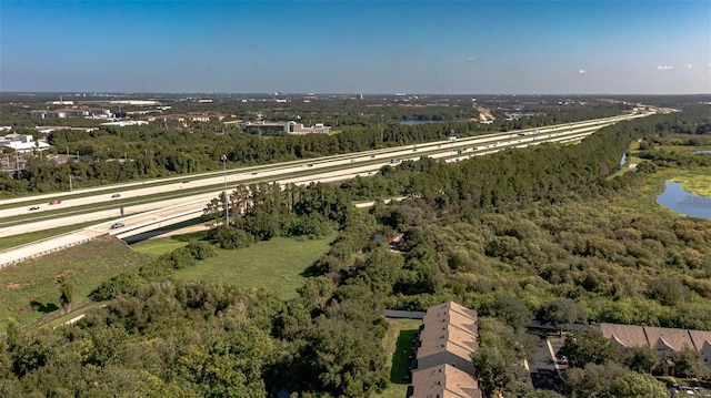 bird's eye view featuring a wooded view