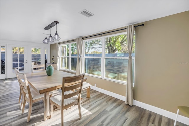 sunroom / solarium with visible vents and french doors