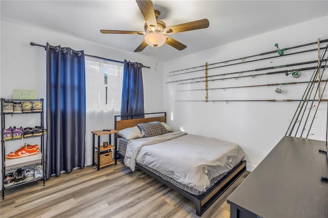 bedroom featuring ceiling fan and light wood-type flooring