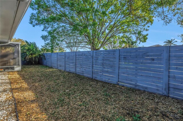 view of yard with a fenced backyard