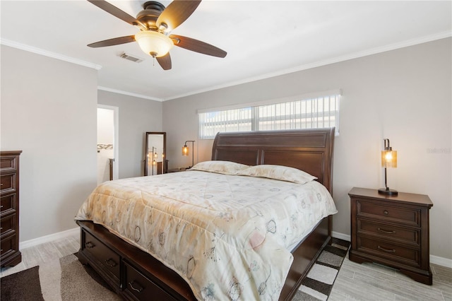 bedroom featuring light wood-style flooring, baseboards, visible vents, and ornamental molding