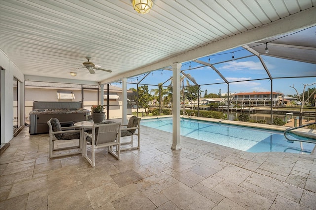 outdoor pool with glass enclosure, grilling area, a patio area, and ceiling fan