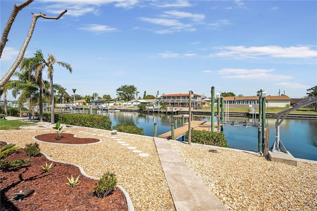 view of dock with a water view and boat lift