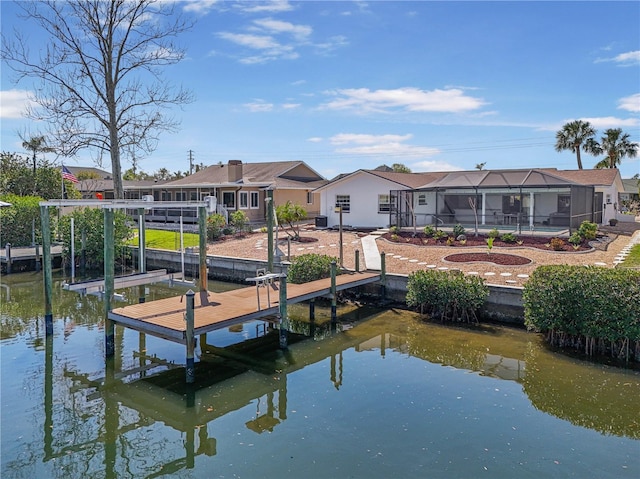 view of dock featuring a lanai, a water view, and boat lift